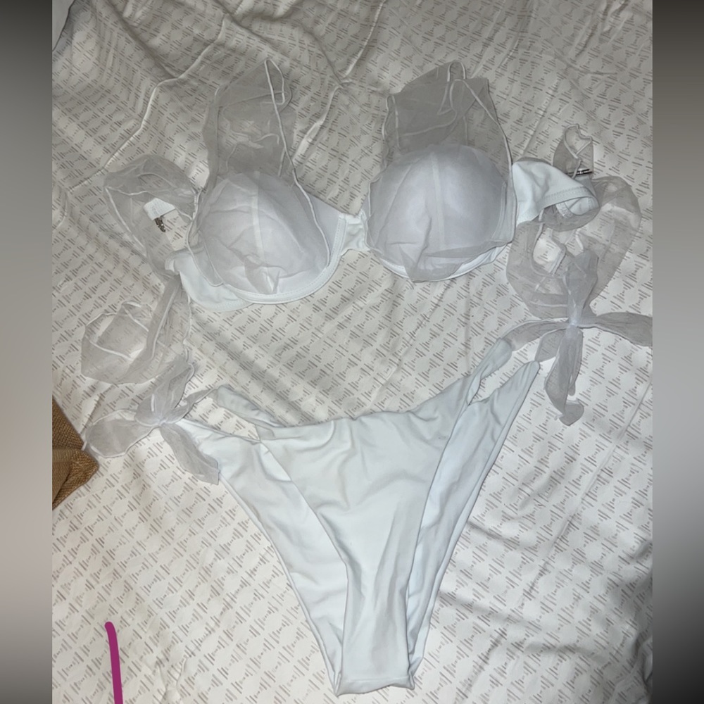 Size large white bathing suit. Never worn but without tags
